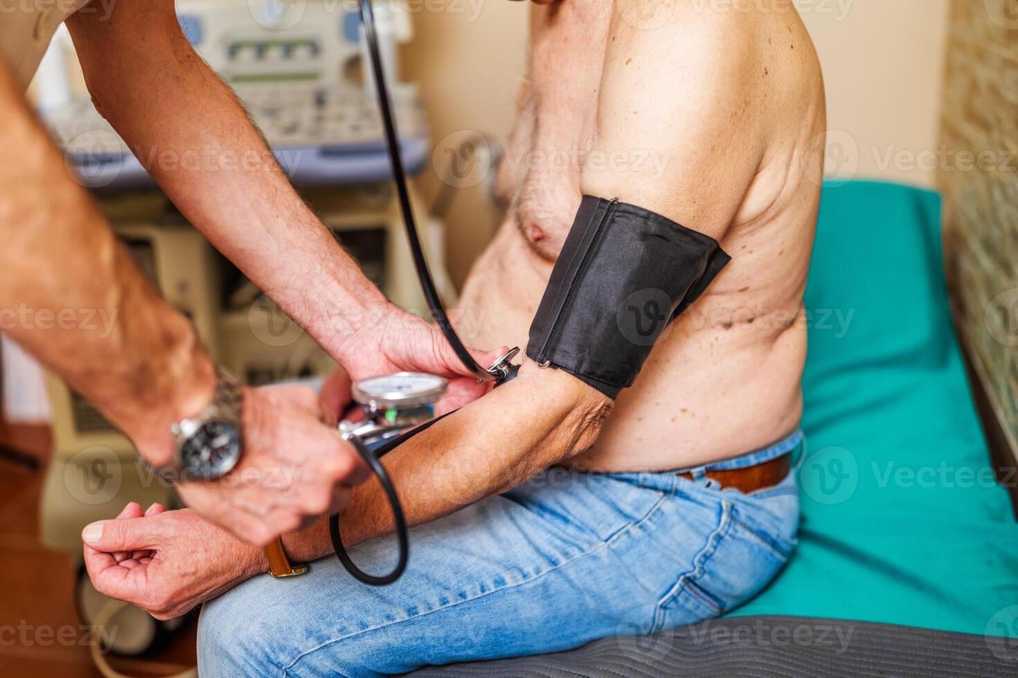 Real life scene of measuring blood pressure to a patient at clinic photo