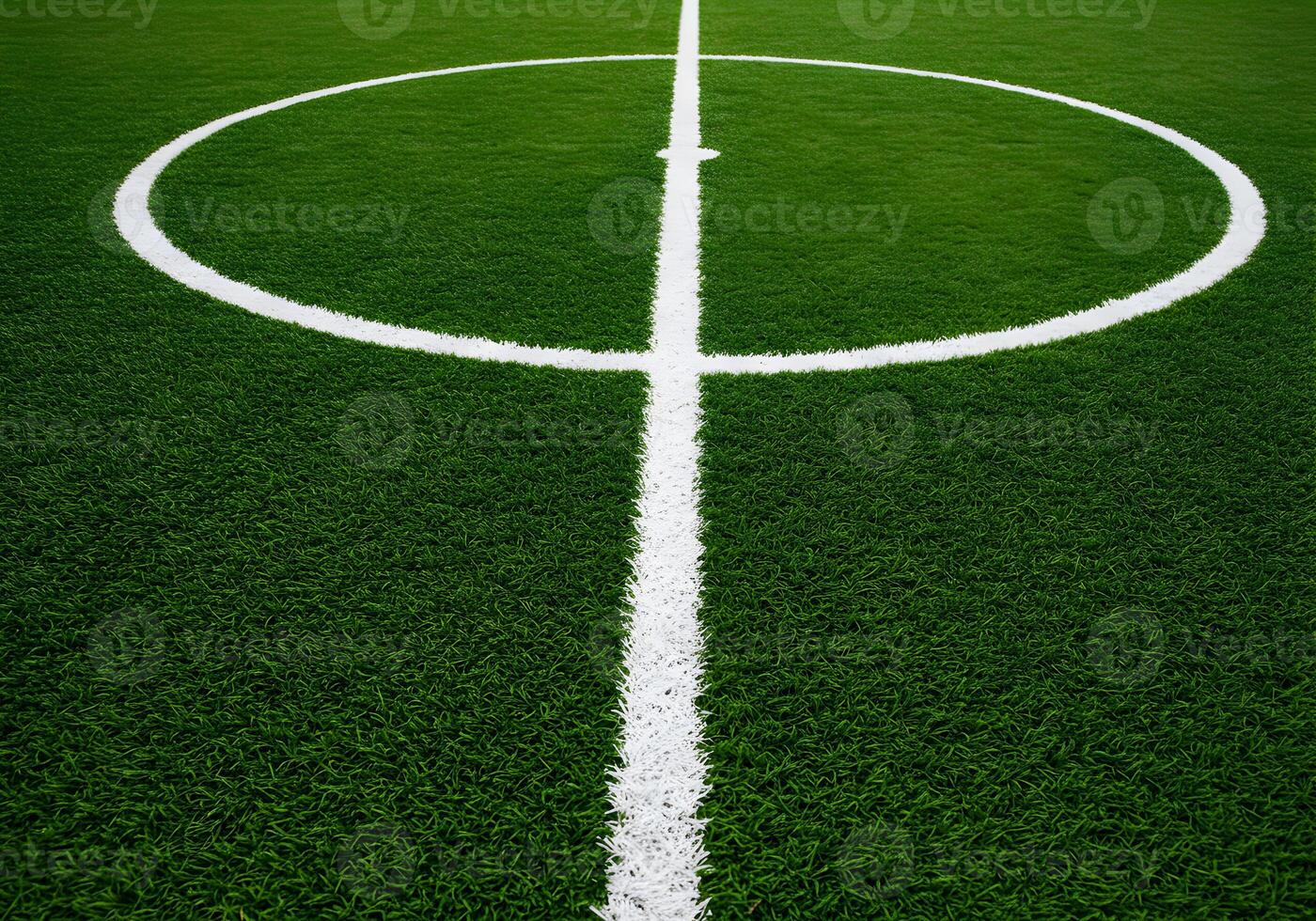 Lush Green Artificial Turf Soccer Field with Center Circle Markings photo