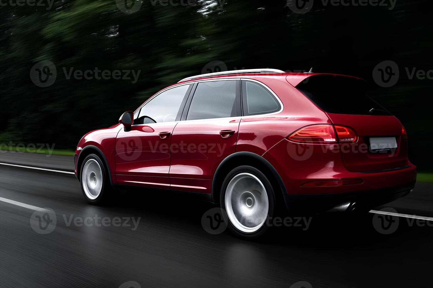 Red Luxury SUV Driving on a Scenic Road at Night photo