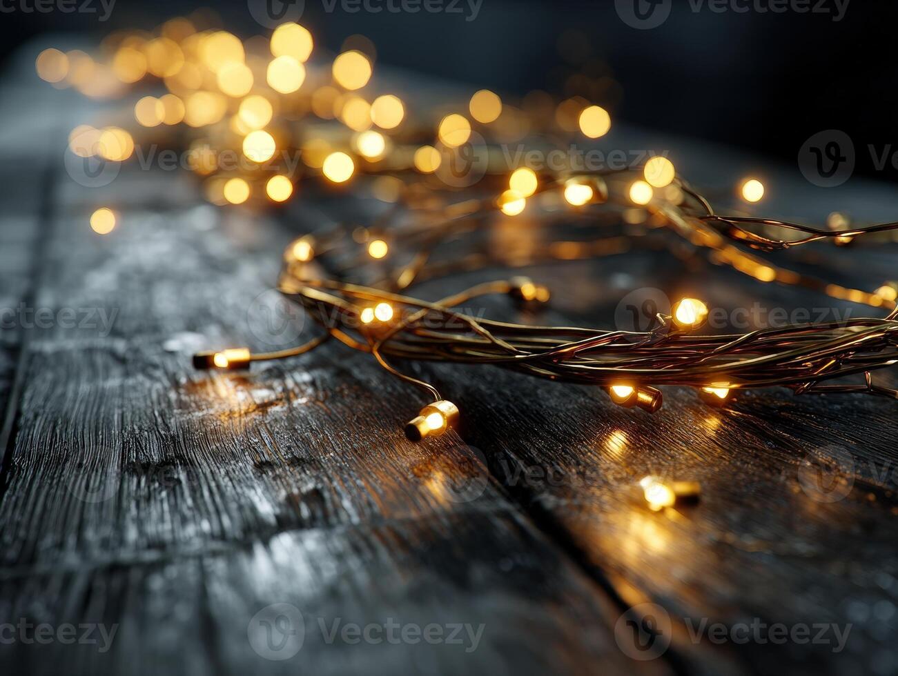 Golden fairy lights intertwined on a wooden surface, creating a warm, glowing ambiance. The rustic texture of the wood contrasts with the soft, unfocused bokeh lights. No text present photo