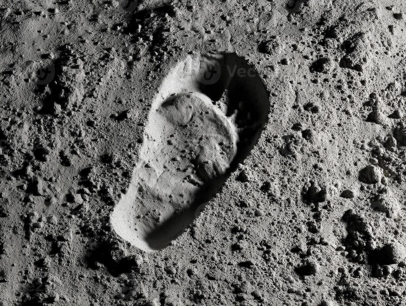 Single shoe print impression in fine granular surface, resembling extraterrestrial ground, surrounded by small rocks and uneven texture, captured with high contrast grayscale photo