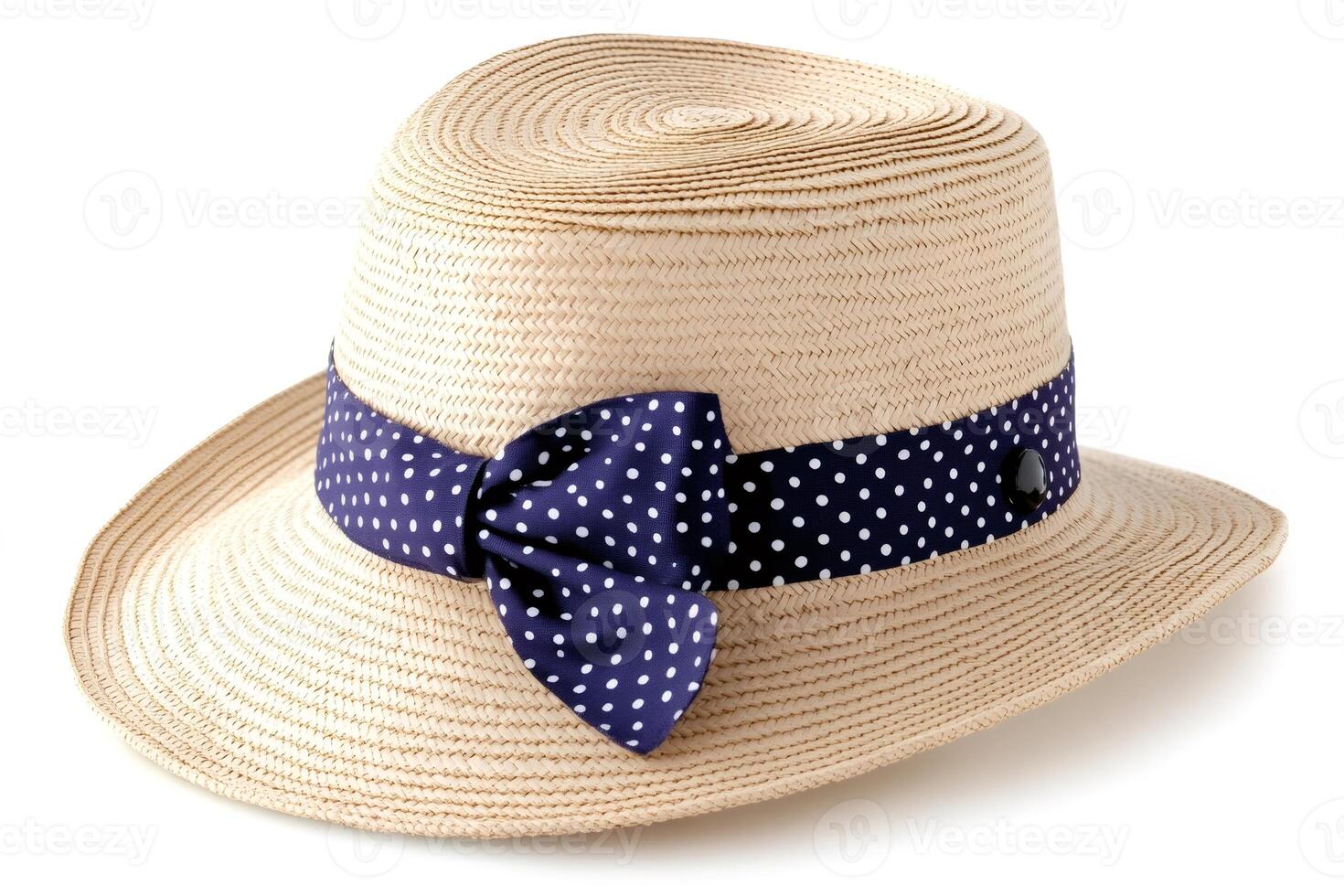 Elegant straw hat with navy blue polka dot ribbon on white background photo
