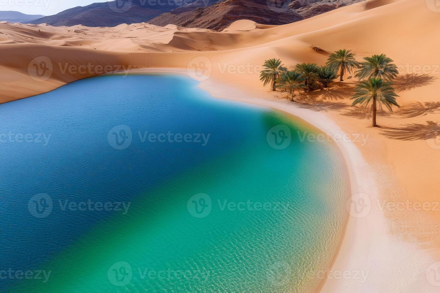 Turquoise desert oasis reflecting palm trees under blue sky photo