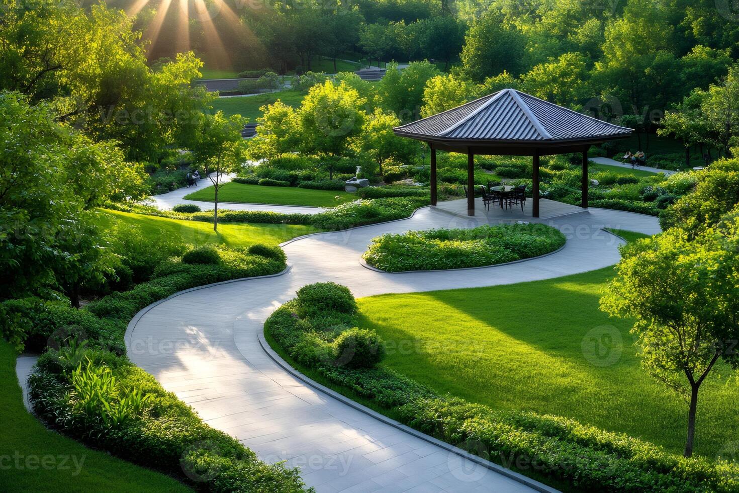 Winding paths leading to gazebo in lush green park during sunny day photo