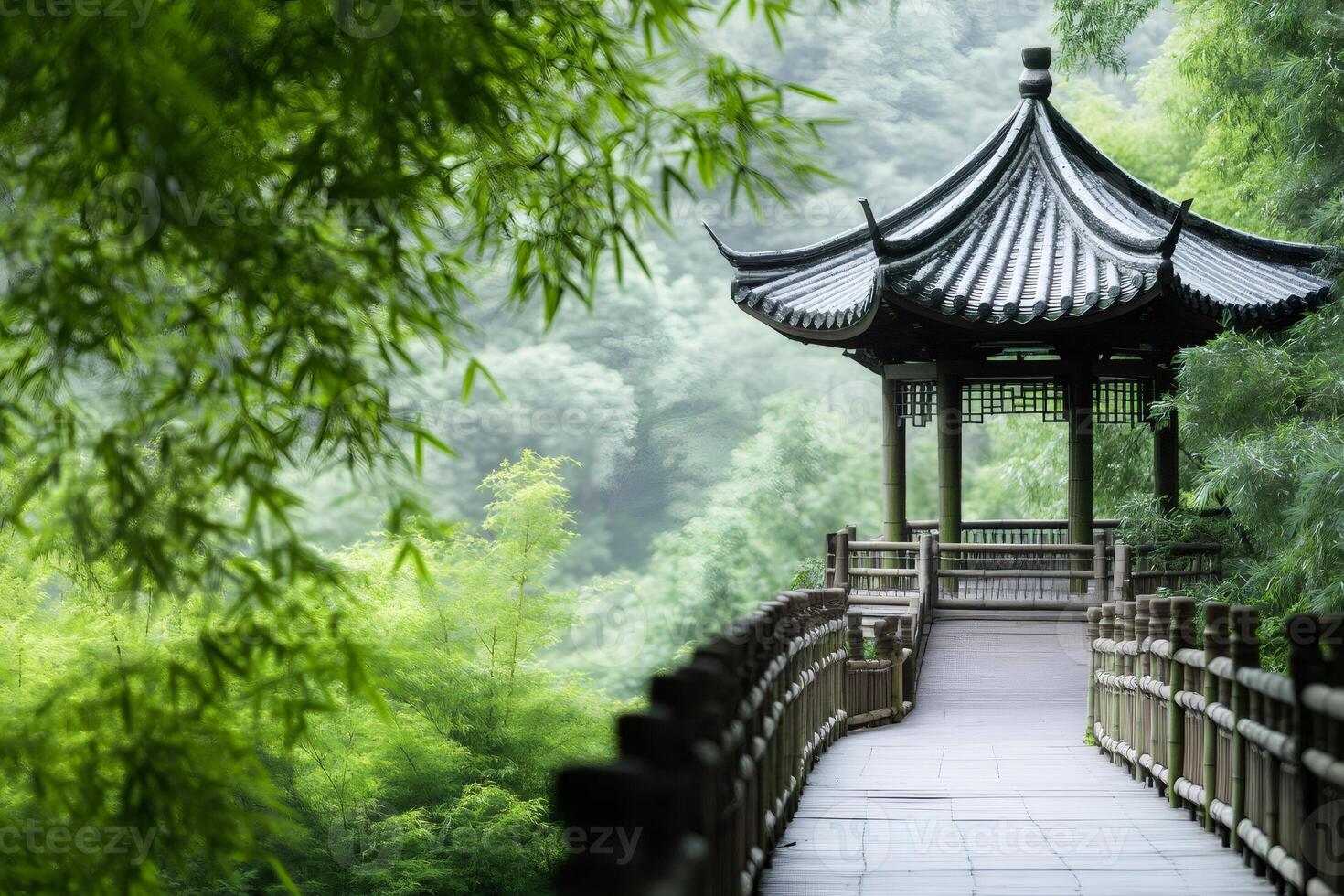 Wooden path leading to traditional Chinese gazebo surrounded by bamboo forest photo