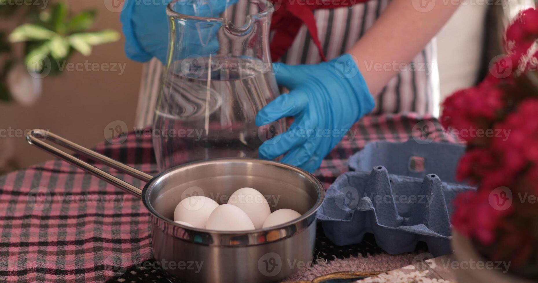 Preparing Easter eggs for coloring, boiling eggs for decoration and family fun during the holiday season photo