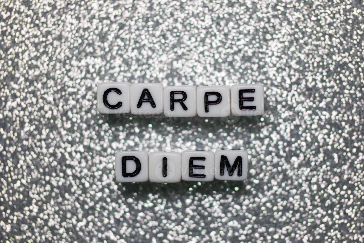 Inspiring message displayed with letter blocks on a shimmering background photo