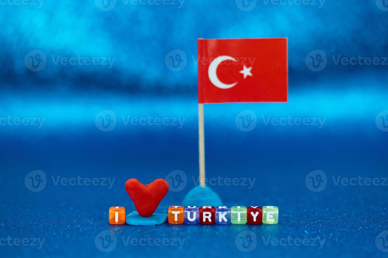 Colorful display of love for Turkey with heart and flag against vibrant blue background photo