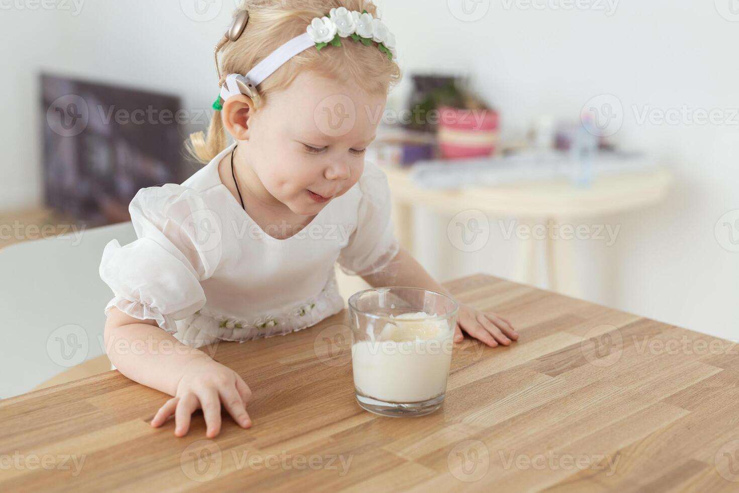 Cochlear implant on baby girl's head. Hearing aid and deafness and diversity concept photo