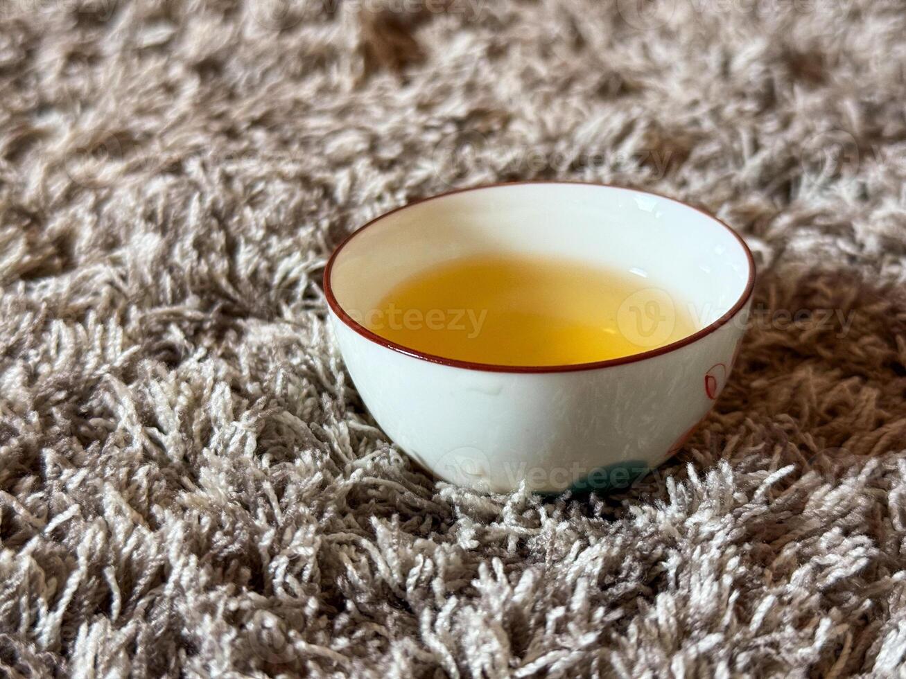 Quiet moment during a traditional tea ceremony with warm tea in a porcelain cup. Harmony, mindfulness and peaceful ritual practice photo