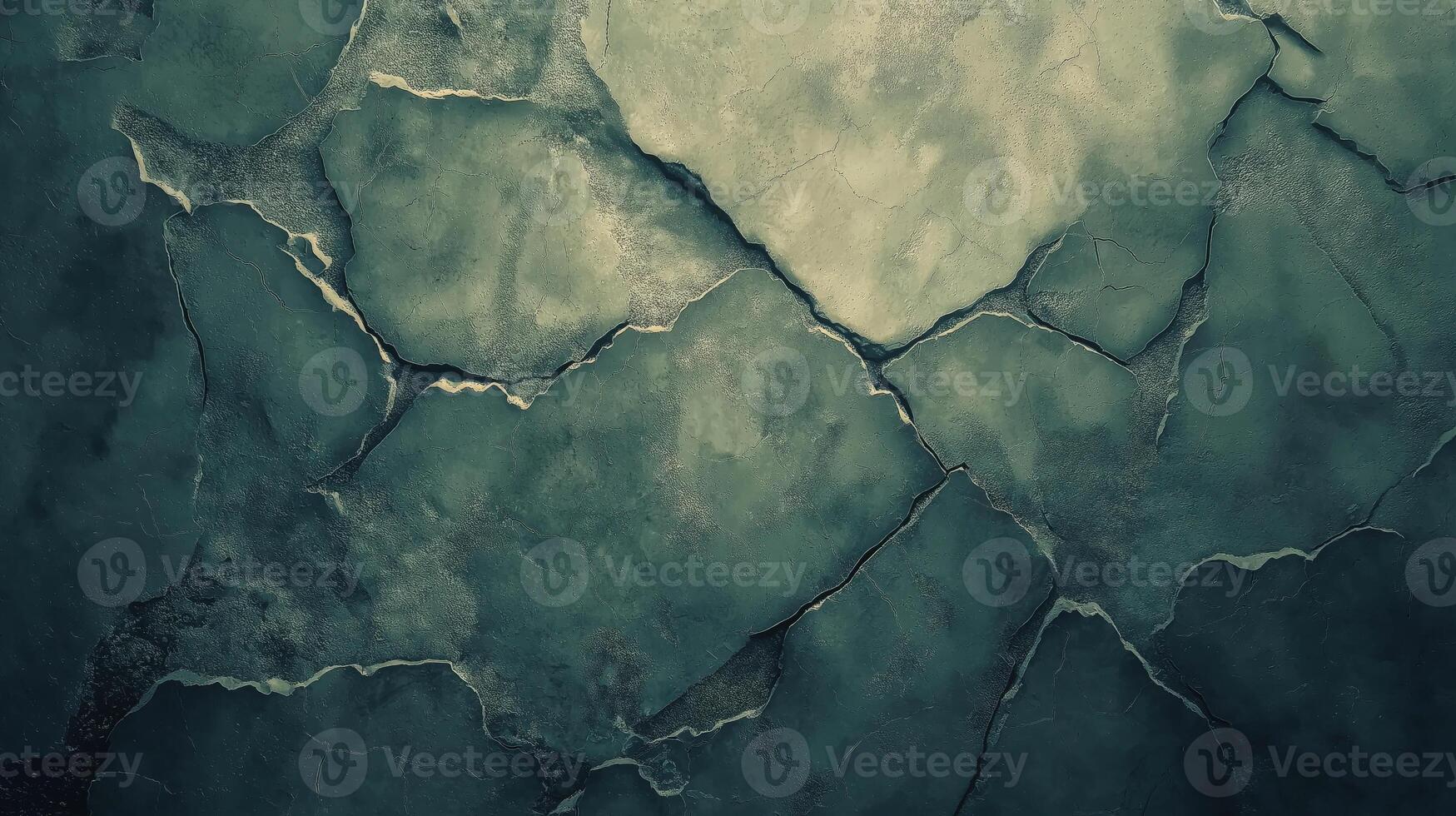 Textured concrete surface displays a pattern of cracks and uneven patches, showcasing the wear of the material. The muted colors contribute to an atmosphere of urban decay and aging. photo