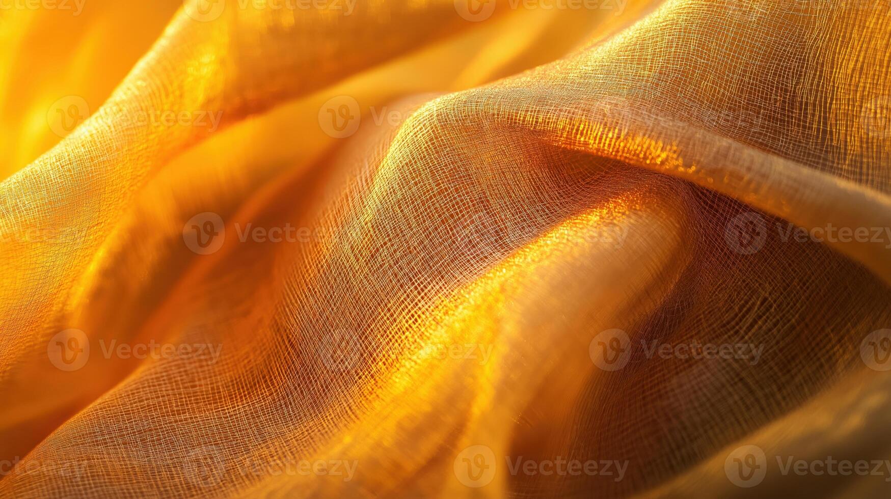 A delicate golden fabric flows gracefully, illuminated by warm sunlight. The interplay of light and shadow highlights its soft texture and intricate folds, creating a serene and inviting atmosphere. photo