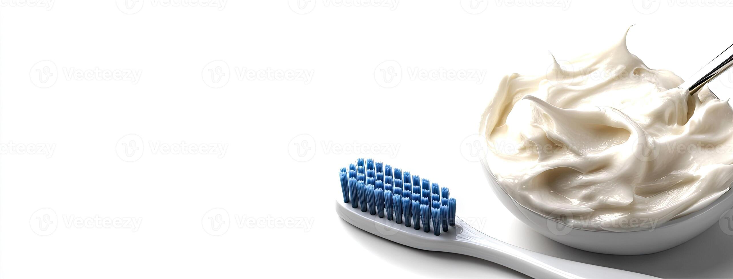 A bowl of cream and a toothbrush photo