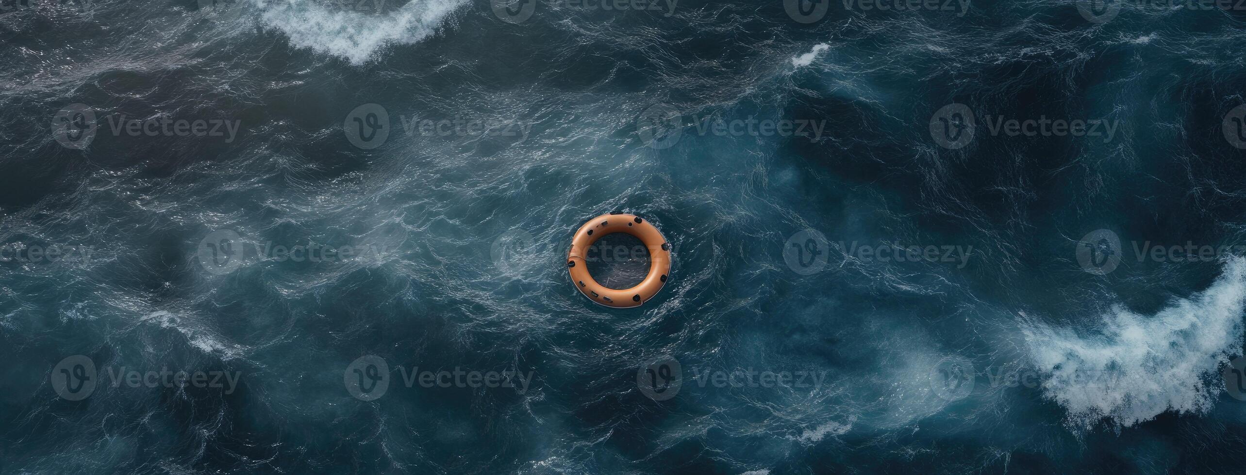 An aerial view of a life ring floating in the ocean photo