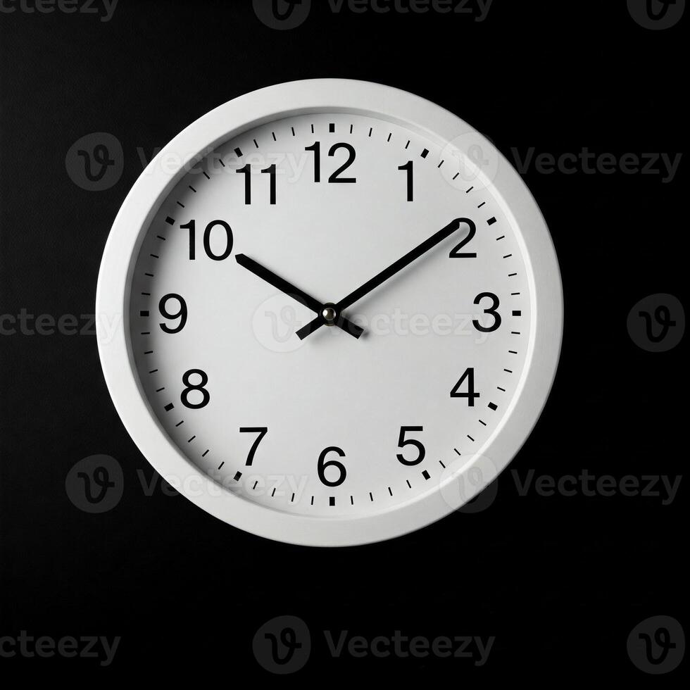 A white clock on a black background photo
