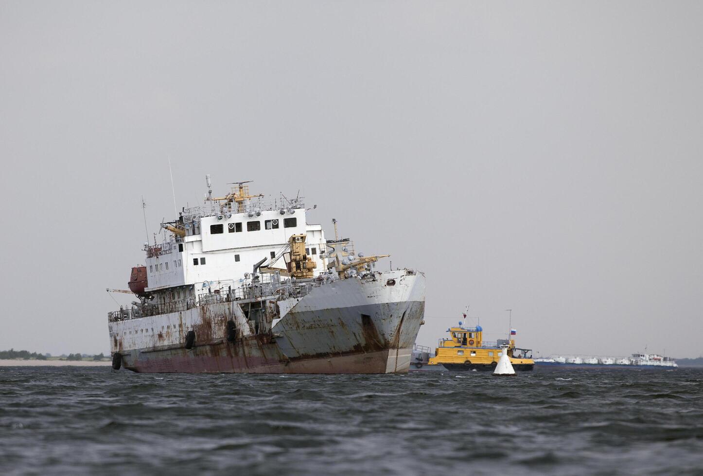Abandoned ship in a harbour photo