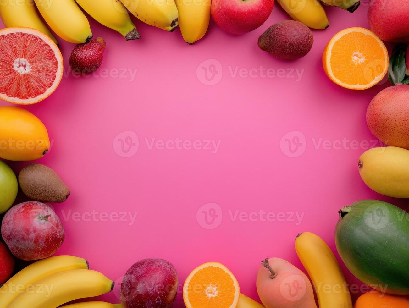 fresh fruits and vegetables arranged in a circle on a pink background photo