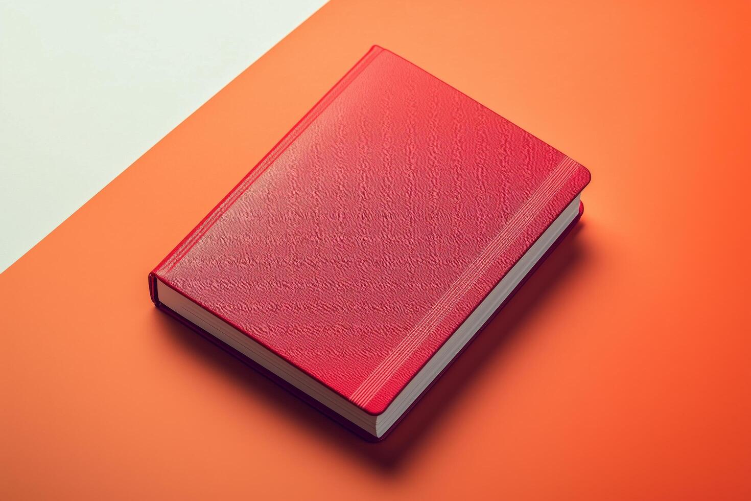 A red book on an orange and white background photo