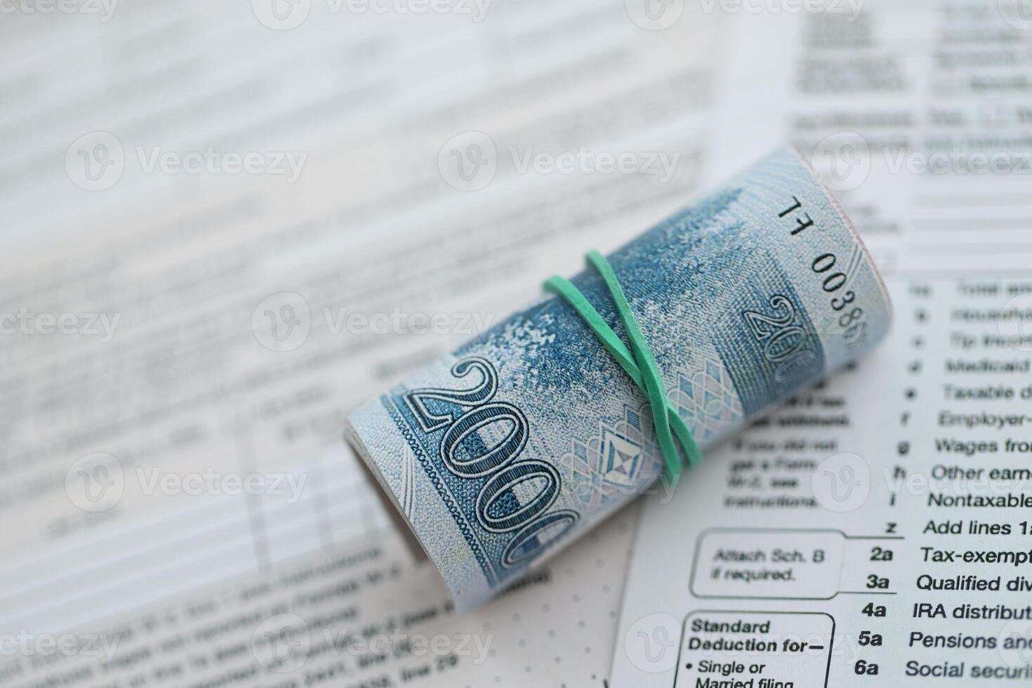 North Korean won money bills in big amount lies on table with tax forms close up photo