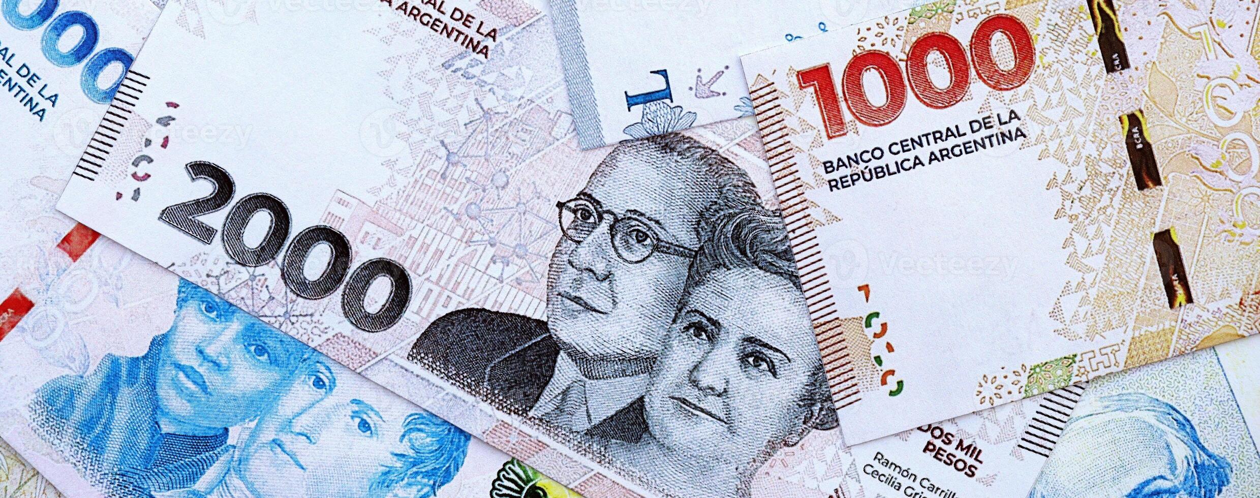 Argentine pesos money bills lies on white table close up photo