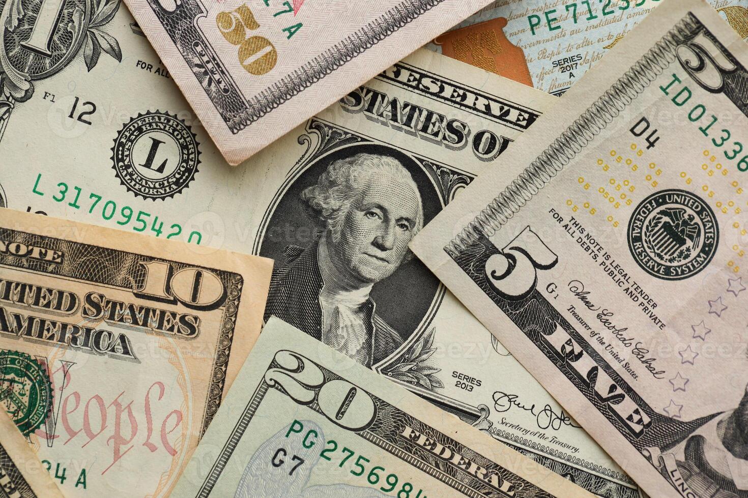 Stack of dollar bills. Hundred, fifty, twenty, ten, five dollars banknote close up photo