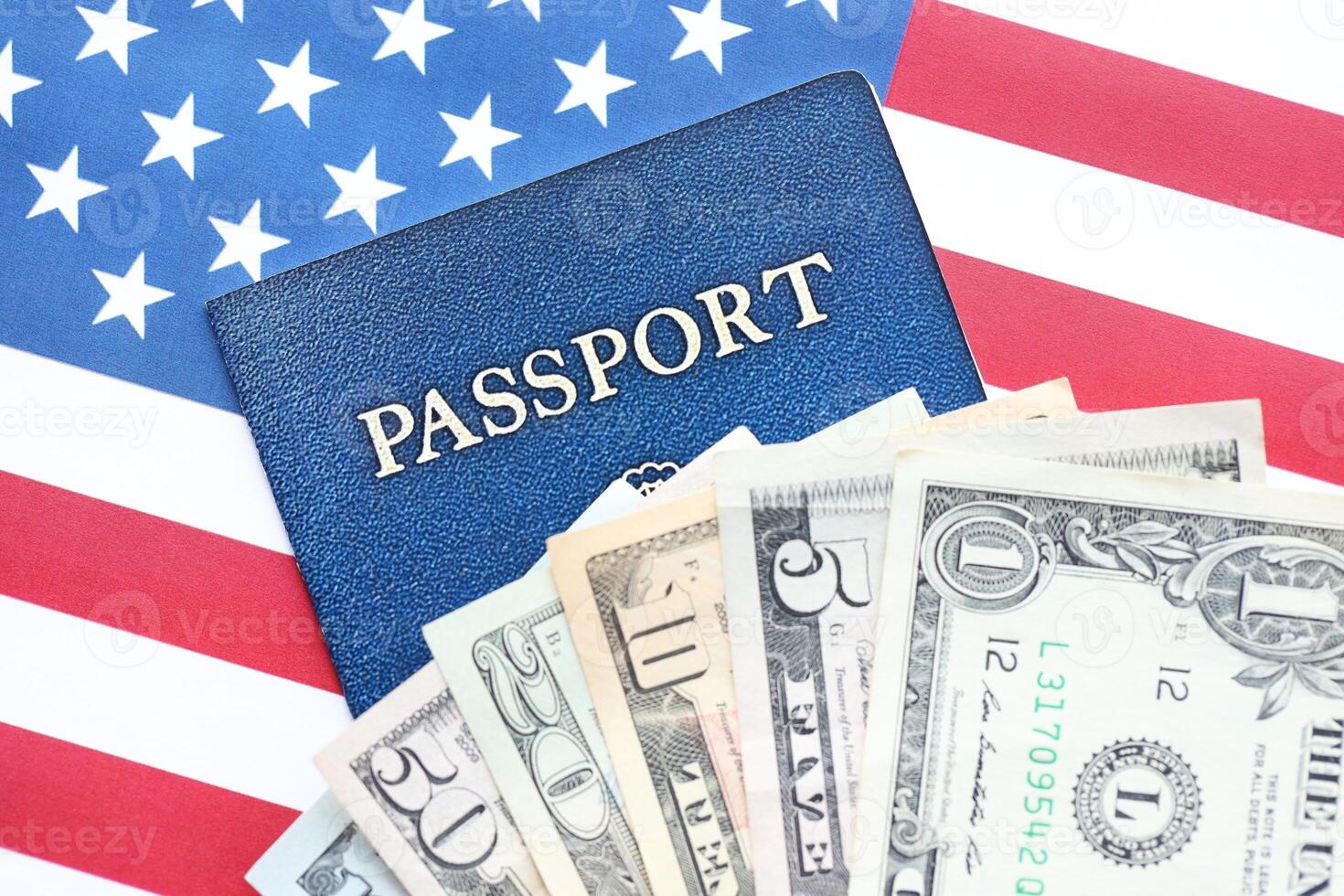 American US dollars money bills and passport with american flag photo