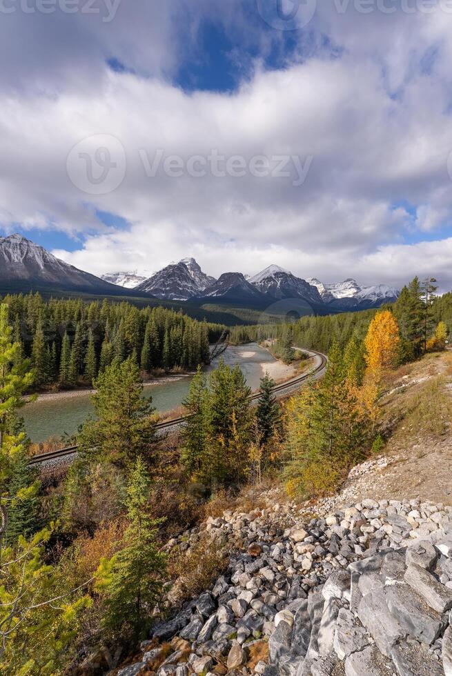 Beautiful Mountains, pine forest, and railroad at Morant's Curve in Autumn photo