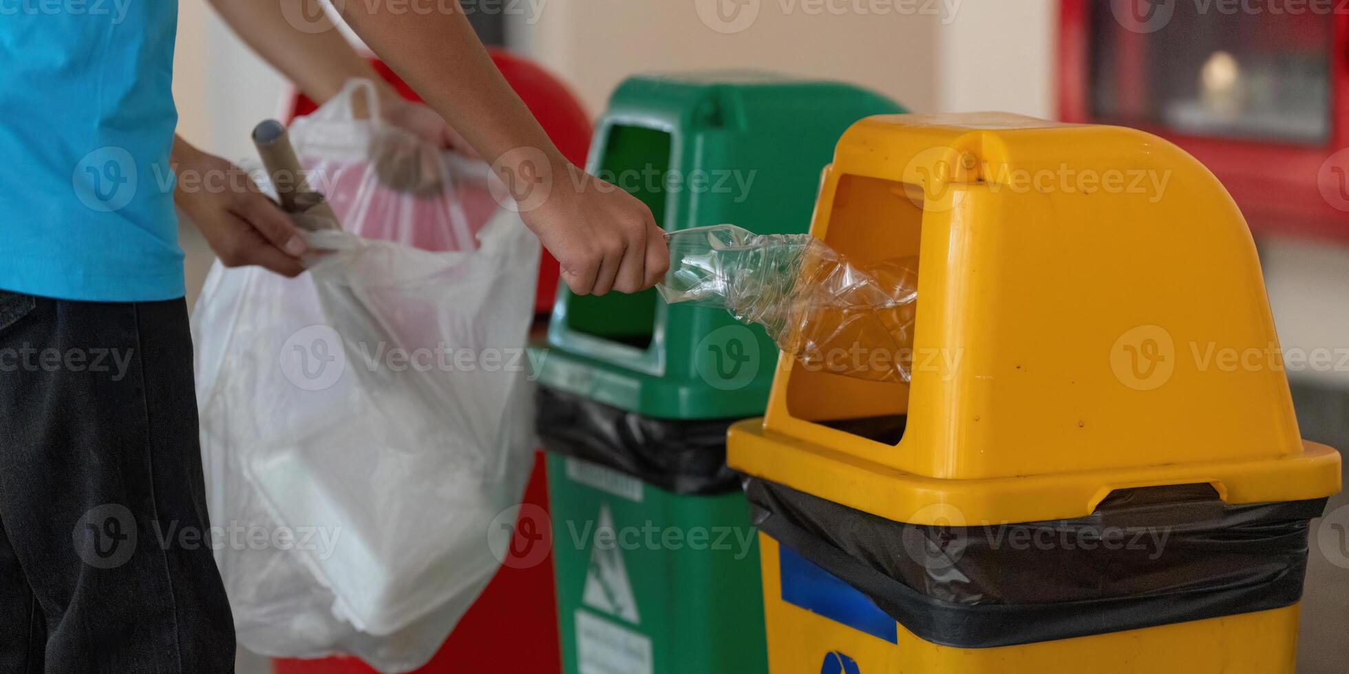 Sustainable Living and Family Activities. A child learning about recycling through hands-on practice with waste disposal. photo
