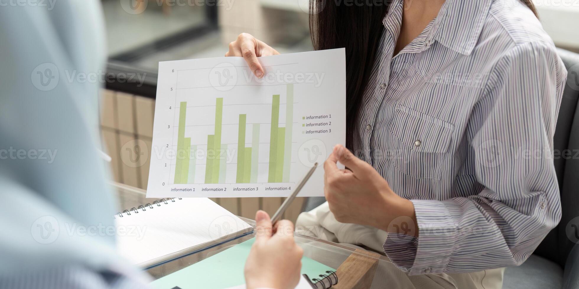 Data Analysis and ESG Strategies. Discussion on sustainable practices with visual data in a corporate setting. photo