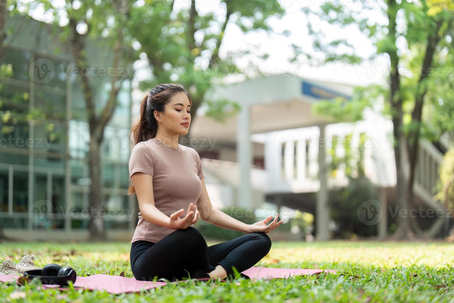 Wellness and Meditation. A woman practicing meditation outdoors with a serene expression, enhancing her mental well-being. photo