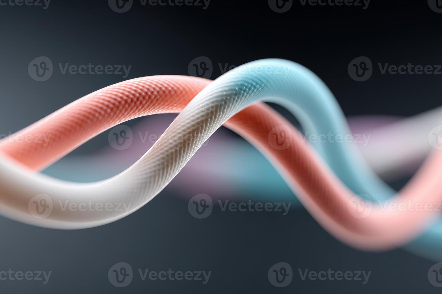 Colorful twisting cords create dynamic patterns with smooth textures photo