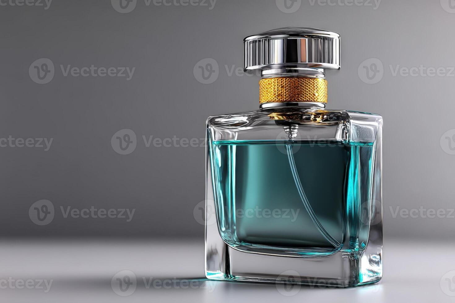 Elegant glass perfume bottle with a golden cap showcasing a blue fragrance in a minimalist setting photo