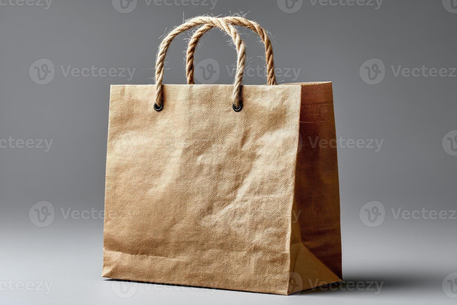Craft paper shopping bag displayed on a neutral background showcasing its rustic and eco-friendly design photo