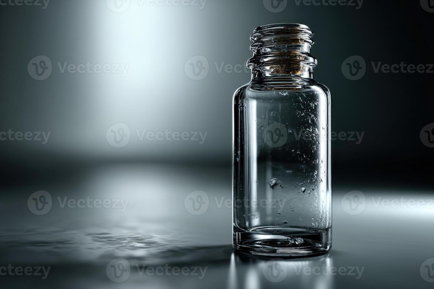Transparent glass bottle with water droplets on a reflective surface in a dimly lit environment photo