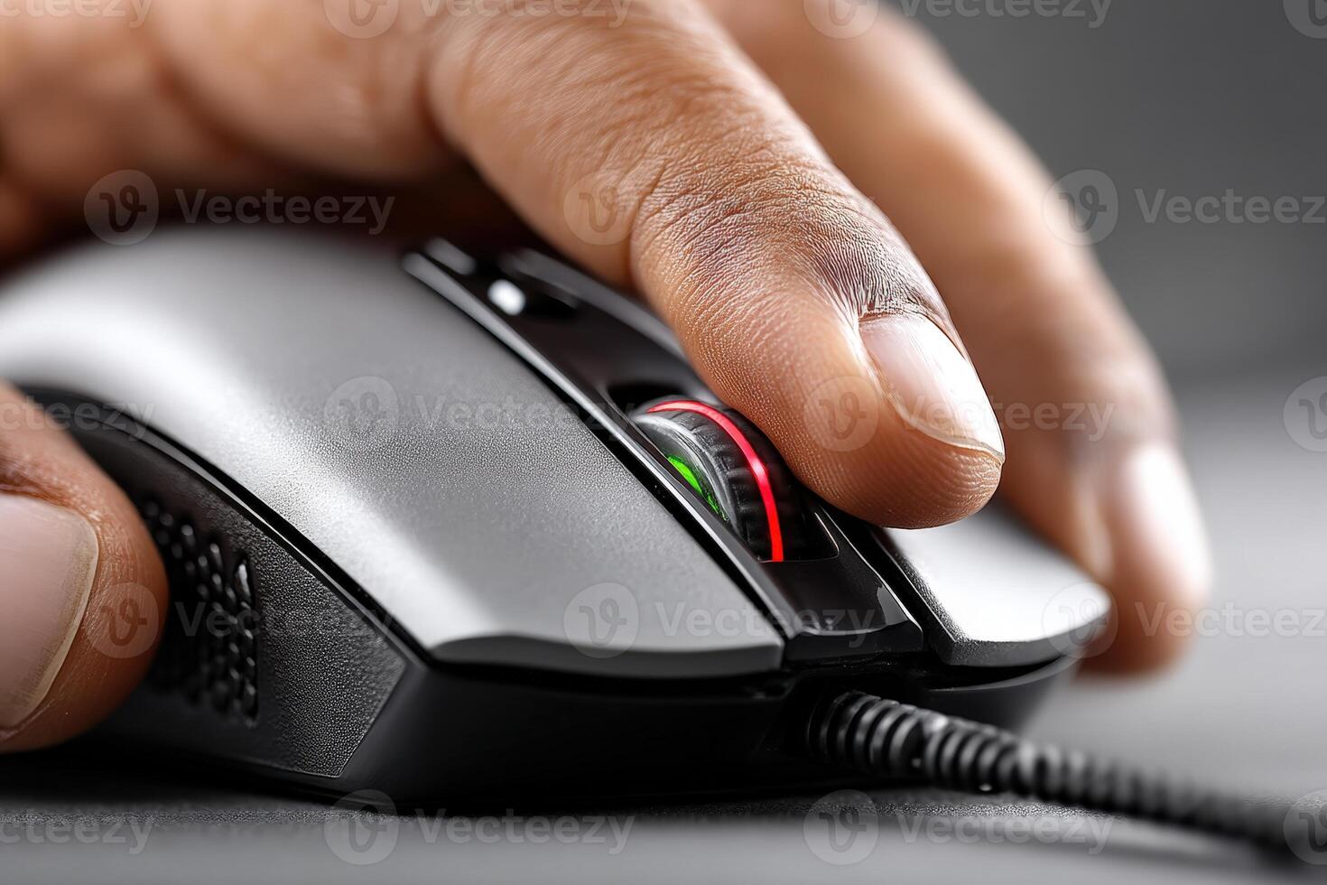 Close-up of a hand using a computer gaming mouse with illuminated features during a gaming session at home photo
