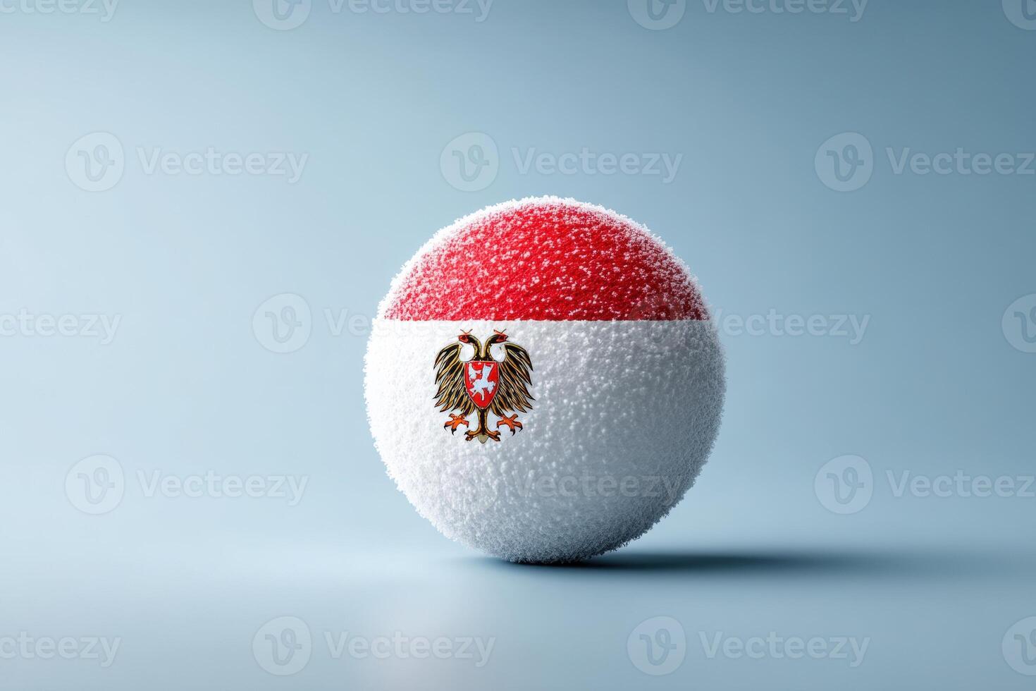 Sphere with Indonesian flag design and eagle emblem resting on a smooth surface photo