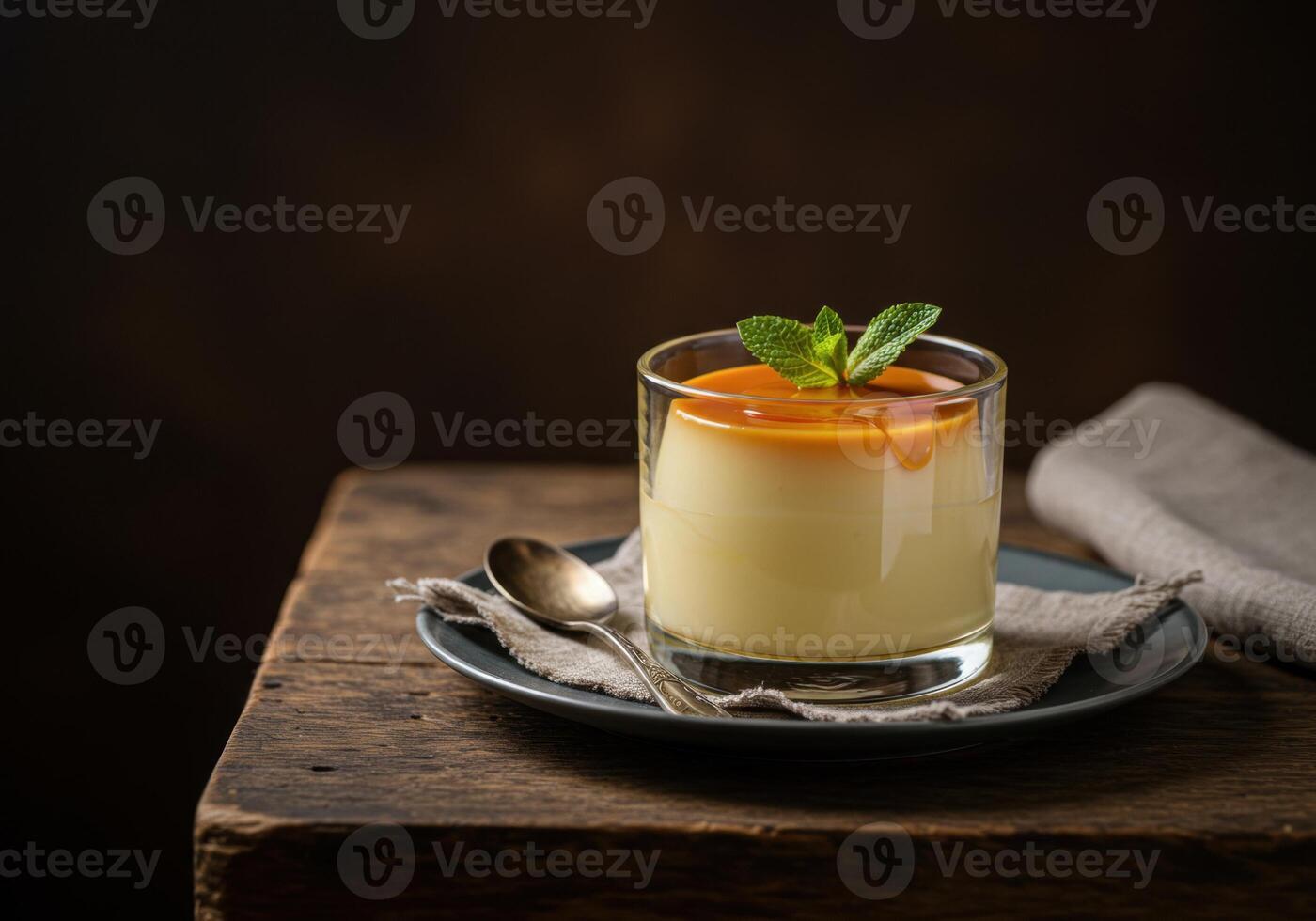 A dessert in a glass on a plate photo