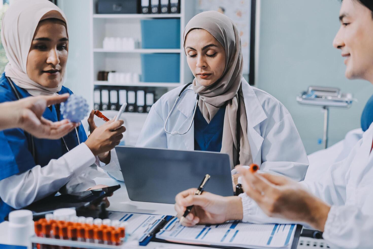 A group of doctors and nurses working together photo
