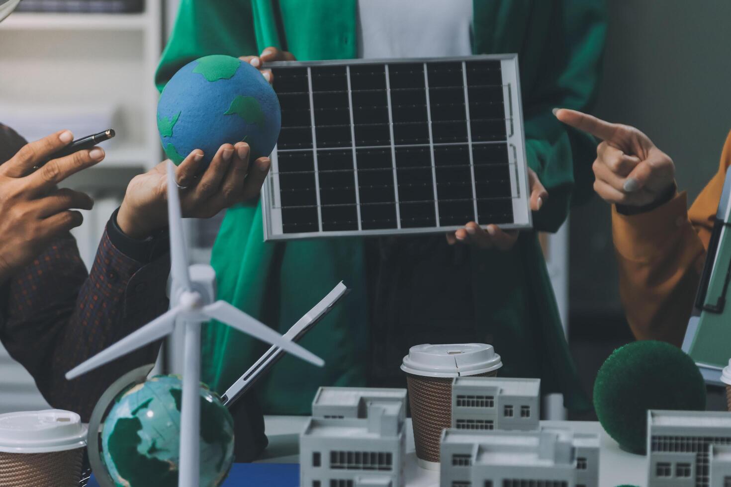 People working together on a project with solar panels photo