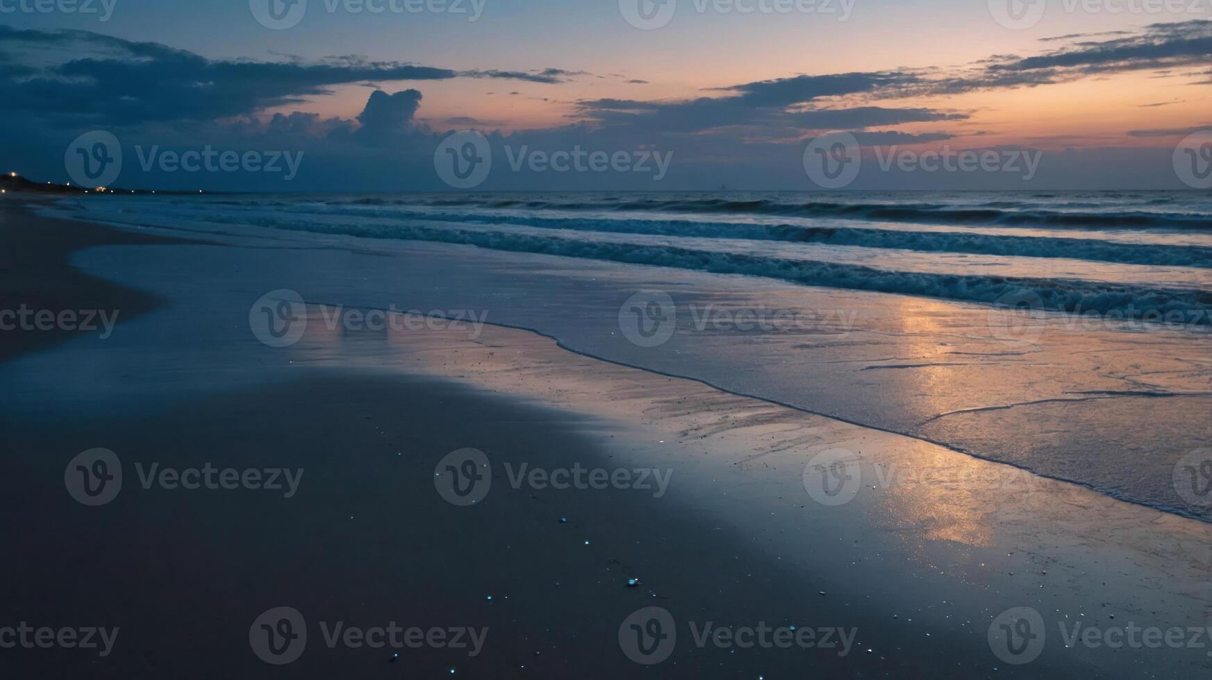 A serene beach scene at sunset, with gentle waves and a reflective shoreline. photo