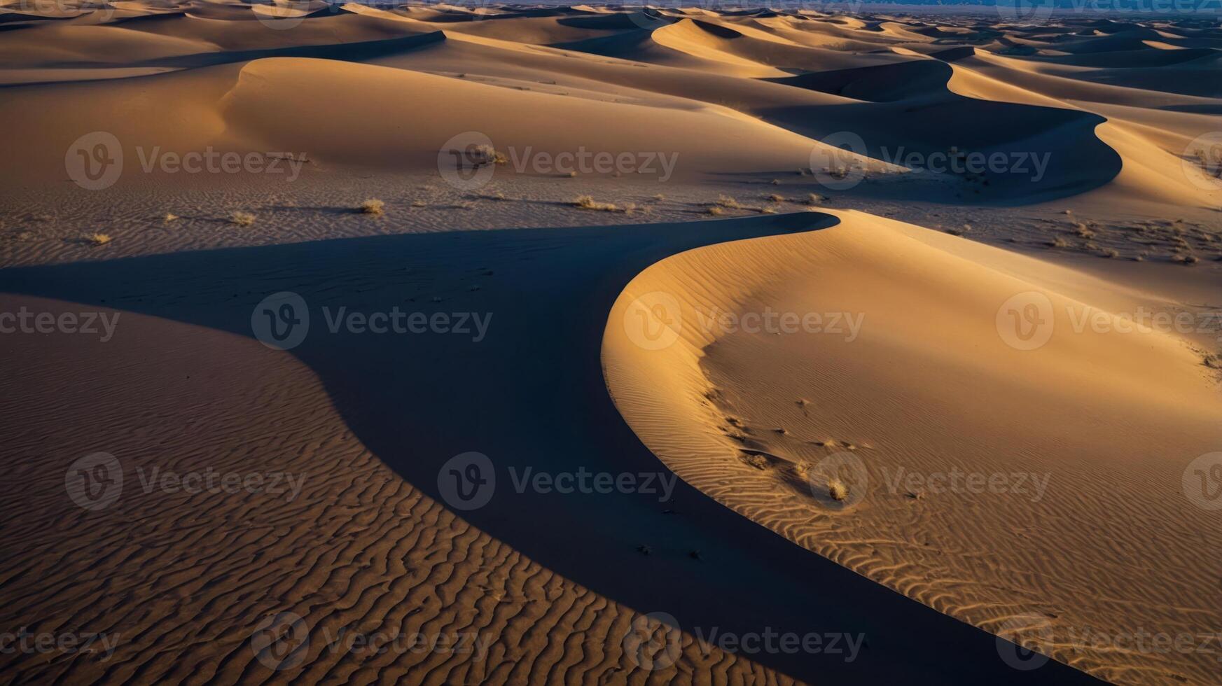 A serene view of sand dunes, showcasing the natural beauty and intricate patterns of the desert landscape. photo