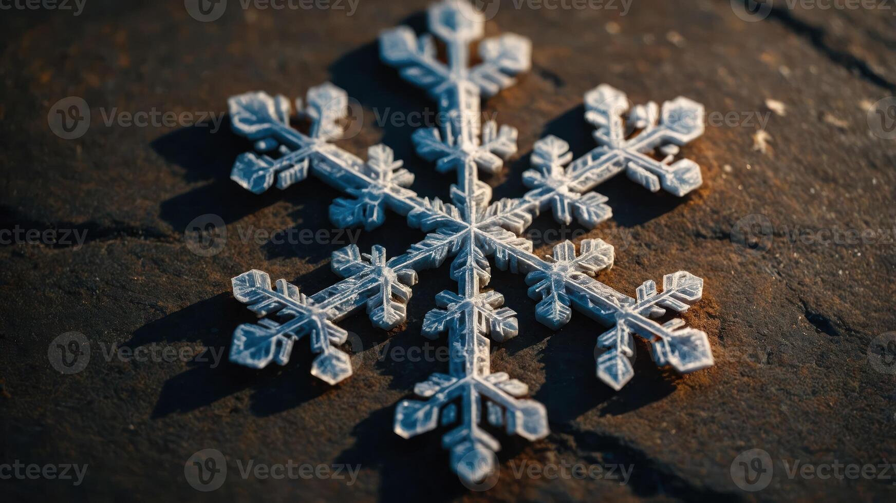 A close-up of a delicate snowflake resting on a textured surface, showcasing its intricate design. photo