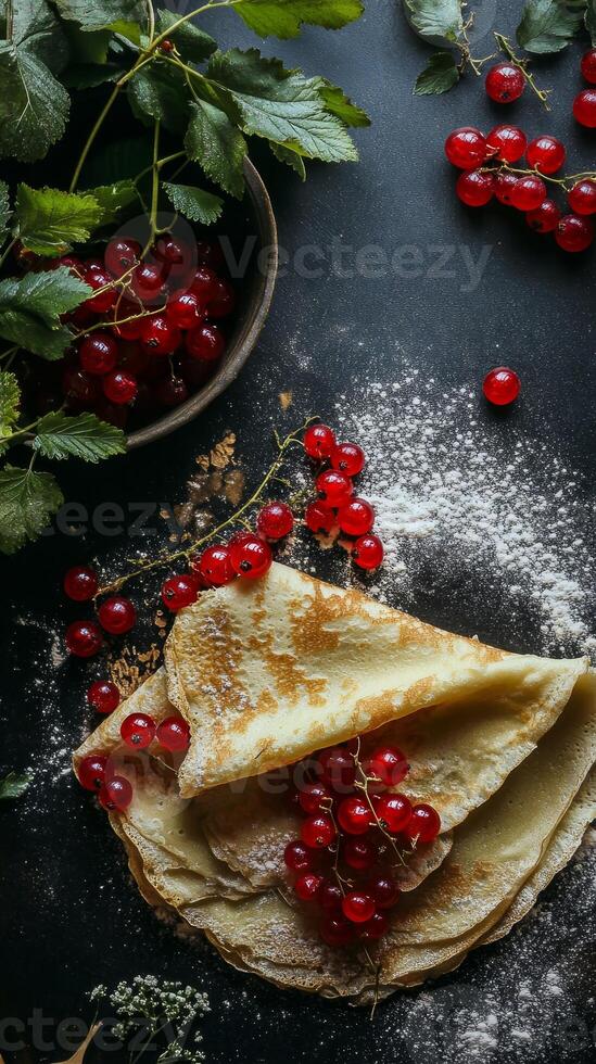 A Stack of Golden Crepes with Red Currants photo
