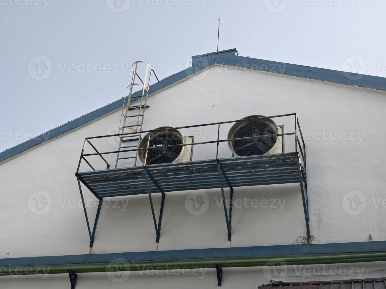 Industrial Building Roof Ventilation Fan with Metal Platform and Ladder photo