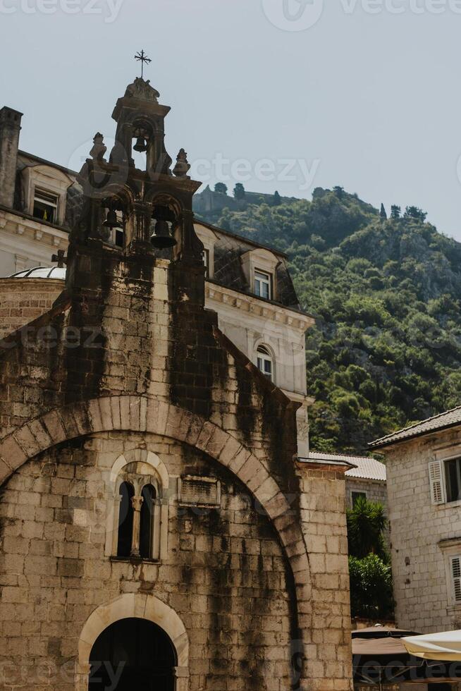 Old church on a sunny day in the old town of Kotor in Montenegro. photo