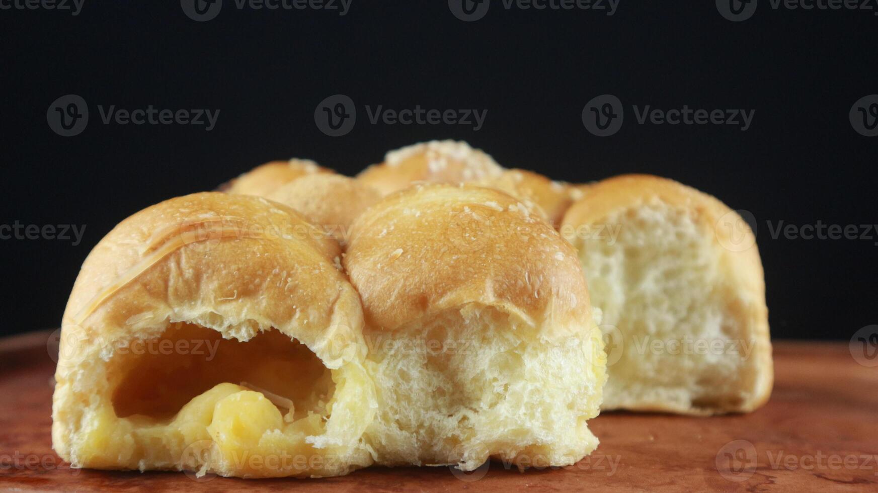Homemade wheat bread with sesame seeds and cheese. black background photo