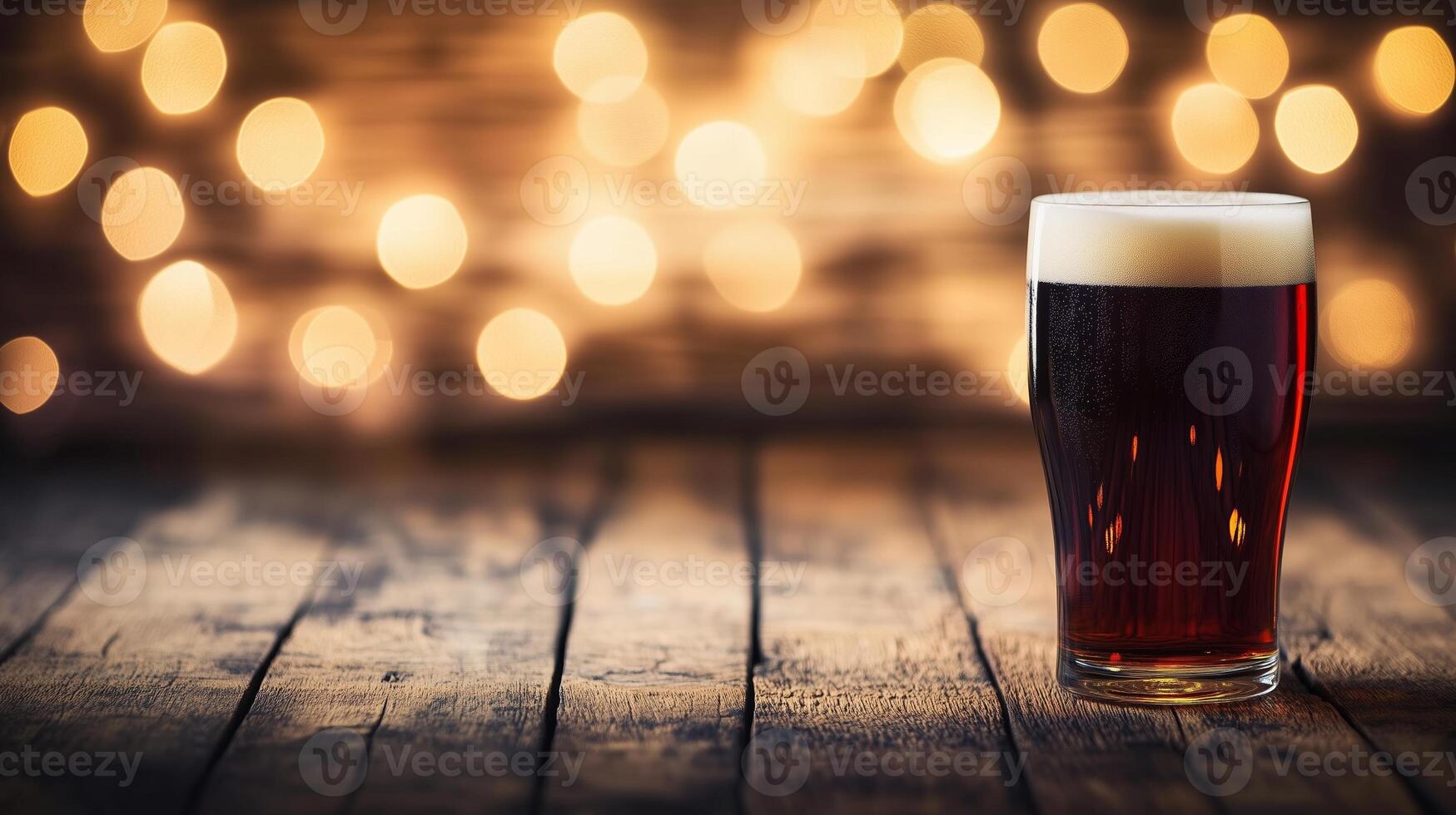 Dark beer in pint glass on rustic wooden table with warm ambient lighting photo