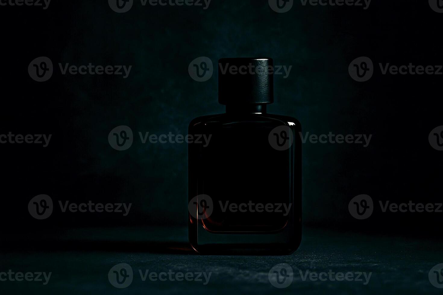 Elegant black perfume bottle in dark moody lighting on textured background with luxurious and mysterious atmosphere photo
