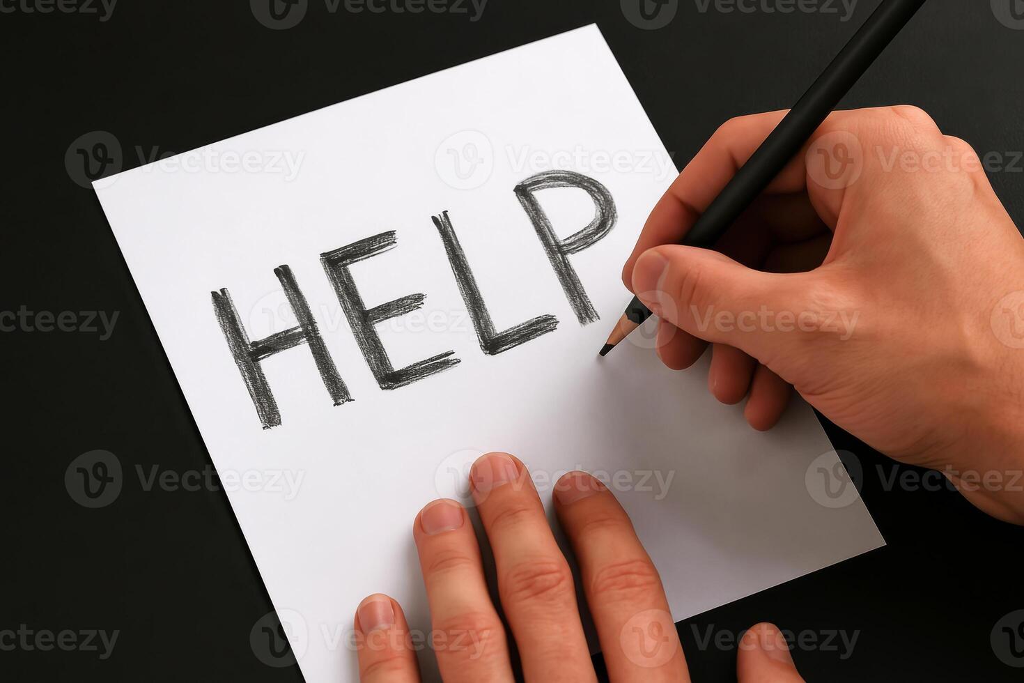 Word help written on white paper by hand with pencil, expressing need or plea for assistance on dark background photo