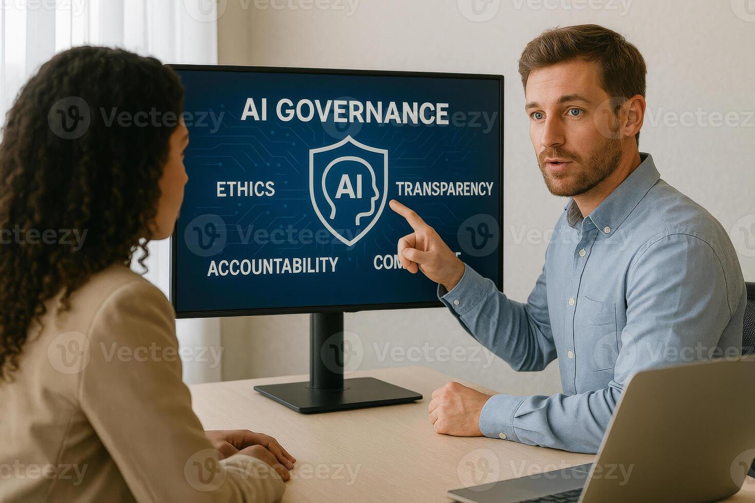 Man explaining artificial intelligence governance principles on screen to colleague photo